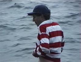 Michael has to wade into the surprisingly deep water to retrieve the frisbee that Ryan inadvertently threw there